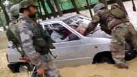 J&K: Army personnel rescue car from overflowing Firozpur Nala near Pattan 