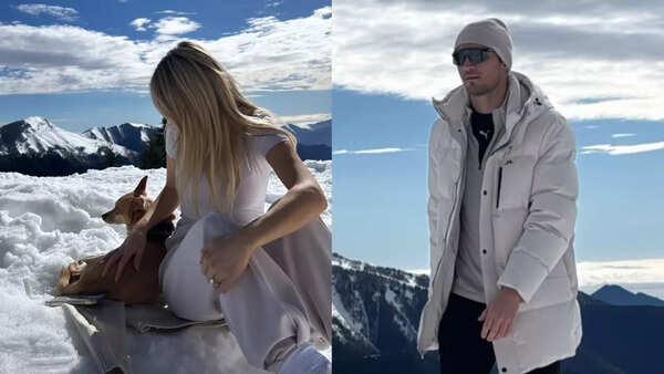Jake Dennis and fiancee Lexi Grace Boosey twin in white as they hit the snow with pup Billy