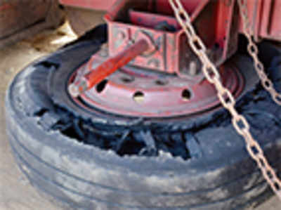 Metal rim of burst lorry tyre sliced him in half