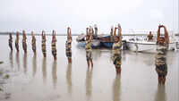 BSF jawans perform yoga on the banks of Brahmaputra in Assam’s Dhubri 