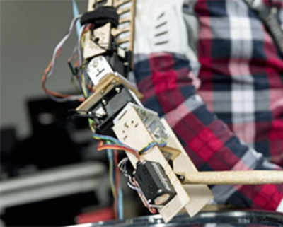 Robot limb lets drummers play with three arms