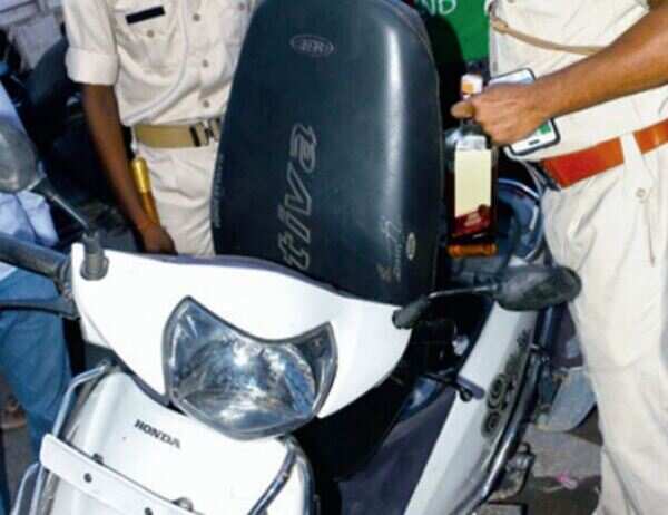 Bootleggers in Ahmedabad abandon cars, ride scooters to sell booze