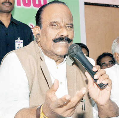 Telangana home min assaults party worker on stage