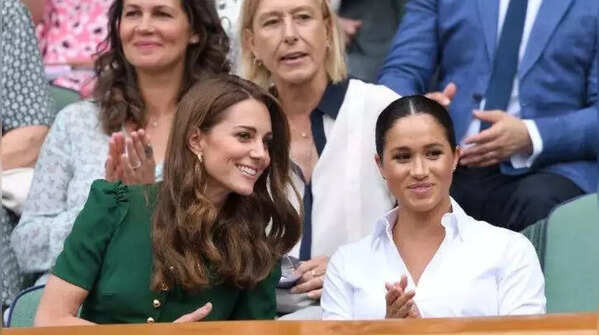 Kate leaning towards Meghan during conversations