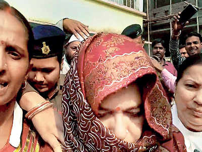 Shelter home rapes: Ex-minister comes in auto to surrender, faints in court