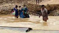 Pregnant woman crosses stream as road access got damaged due to rain in Telangana 