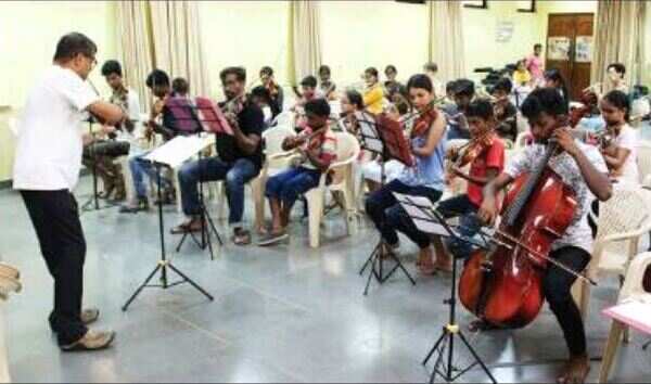 When slum kids and city kids make music together