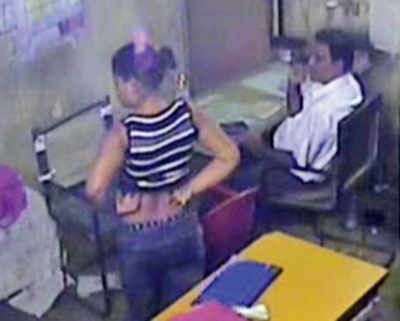 Caught on camera: CR clerk cosies up to lady