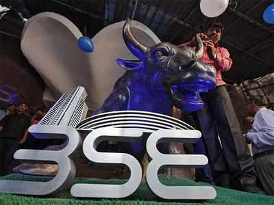 Sensex retreats from record level, plunges by 207 pts