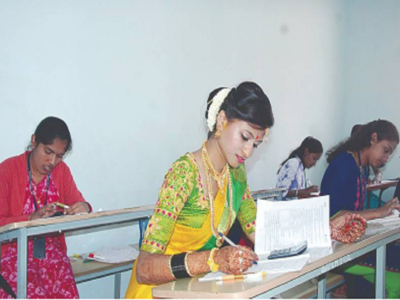 Just after getting married, bride writes university exam