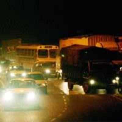 Serpentine queues of heavy vehicles choke traffic movement near Airoli toll plaza