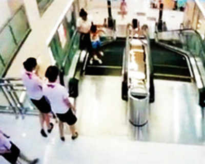 Horror in Chinese mall as escalator swallows woman