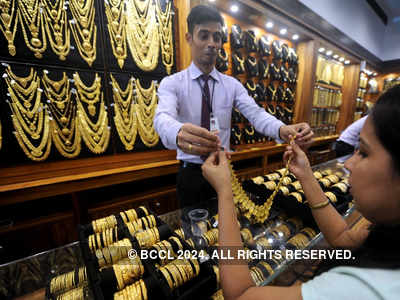 Gold surges on global cues, persistent buying