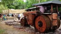 Andhra Pradesh: Police destroy liquor bottles worth Rs 72 lakh using road roller in Krishna district 