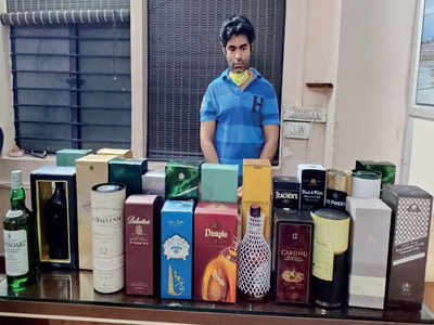 Finance consultant arrested, 24 bottles of liquor seized