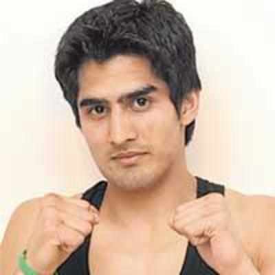 Vijender enters quarters, one win away from medal