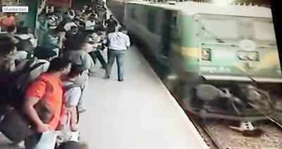 Woman survives after being run over by Mumbai local train while talking on phone