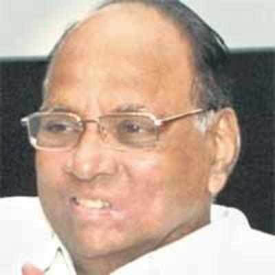 Pawar squeezes himself into economy class seat