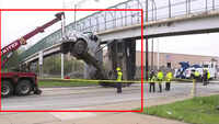 On cam: Dump truck bed gets stuck under bridge 