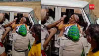 Police personnel gets thrashed by a female resident while seizing illegal land 