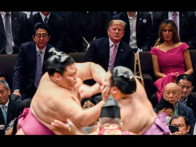Trade talks aside: Trump, Abe bond over burgers, sumo, golf