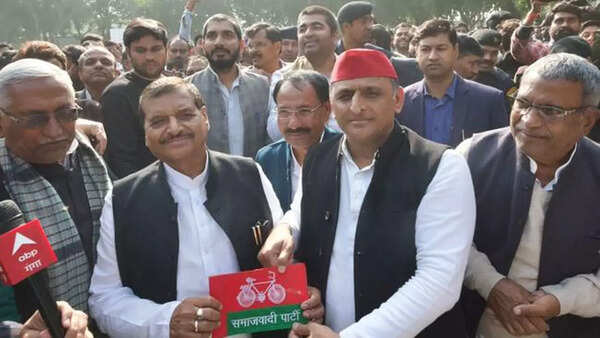 Akhilesh Yadav presents Samajwadi Party's flag to Shivpal Yadav as Dimple Yadav secures lead of over 2 lakh votes in Mainpuri Lok Sabha bypoll