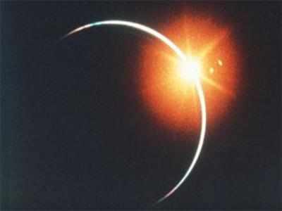 Stargazers applaud as moon eclipses sun