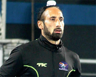 By default, Sardar Singh gets to be the flag-bearer