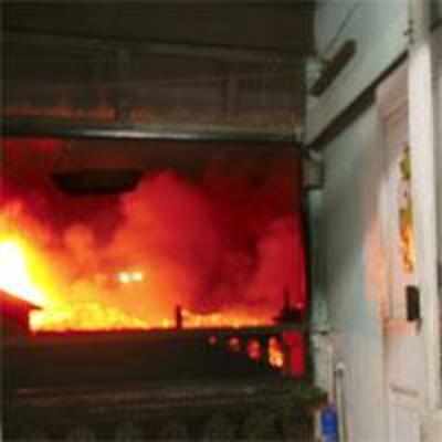 Navy, firemen fight over naval dockyard blaze