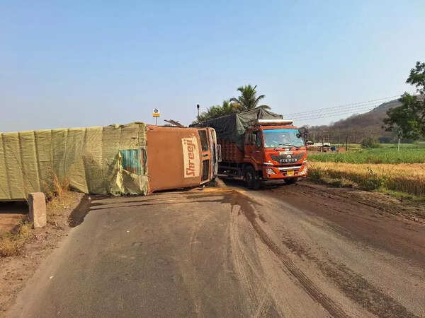 Traffic disrupted on Pune-Bengaluru highway for 30 minutes after container truck tips over