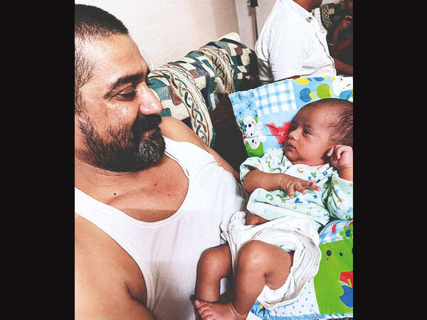 Gujarat: Dads made single by Covid tend to babies and grief