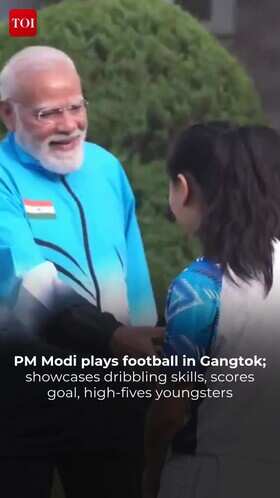 PM Modi Engages in Friendly Football Session with Young Players