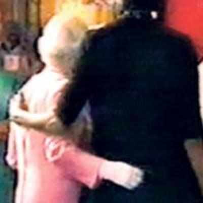 Summit surprise as Michelle hugs Queen