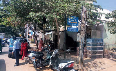 Shop blocks parking space on public road