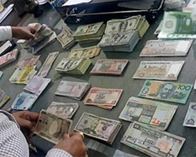 Bus raided for liquor throws up Rs. 68L in foreign currency