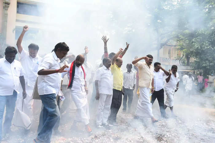 DMK cadre celebrate taking early leads in the local body elections at party headquarters in Chennai