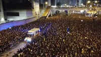 Hong Kong: Protesters allow ambulance to pass through massive protest march 