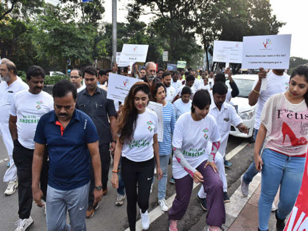 Over 150 residents ‘walk for democracy’ at KBR park