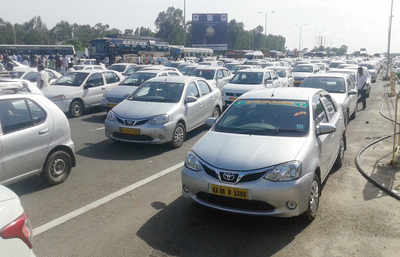 Ola and Uber cabbies block road to airport