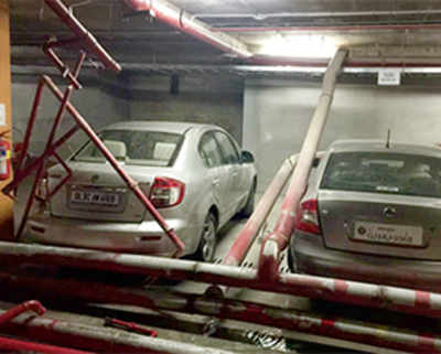 Pipe collapse in posh complex injures two, damages 30 cars