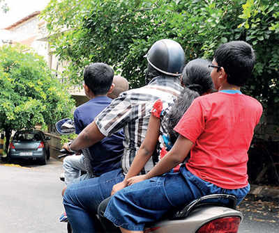 Govt issues order banning pillion riders