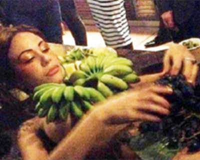 Outrage as Sydney bar uses naked women as fruit platters
