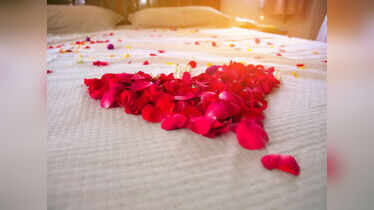 Why is the Indian wedding bed decorated with red roses?