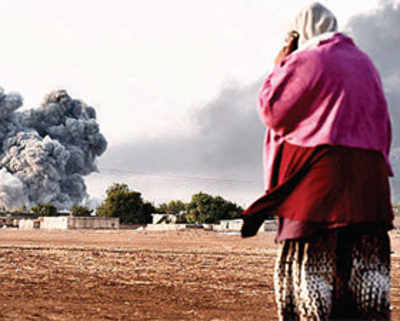 Kurds hold off jihadis in Kobani, ISIS strikes with bombs in Iraq