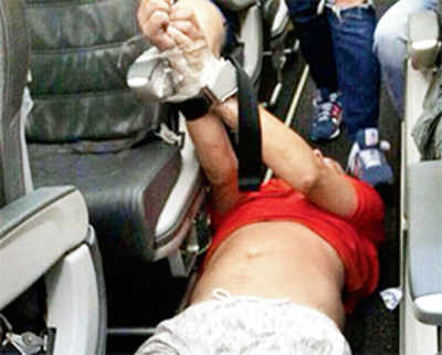 Drunk Russian flier tied up with seatbelts, tape