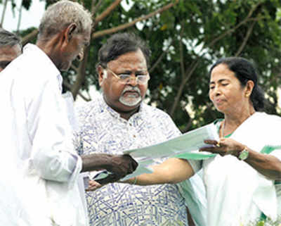 Singur rejoices as Mamata returns land deeds to farmers