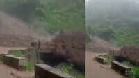 Watch: Landslide washes away bridge as bus passengers watch 