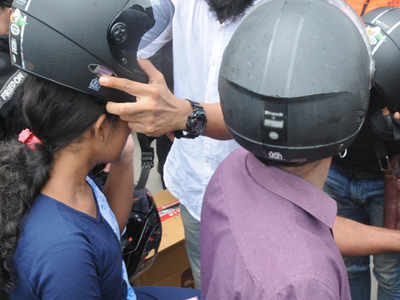 Ferrying kids on two-wheeler? Make sure they wear helmet