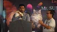 Sudhakar Katikineni showing how to hold Cats and explain about colors and breeds 