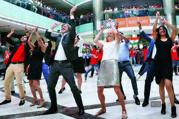 Opera Software employees celebrate accomplishment in Bollywood style at Ambience Mall in Gurgaon